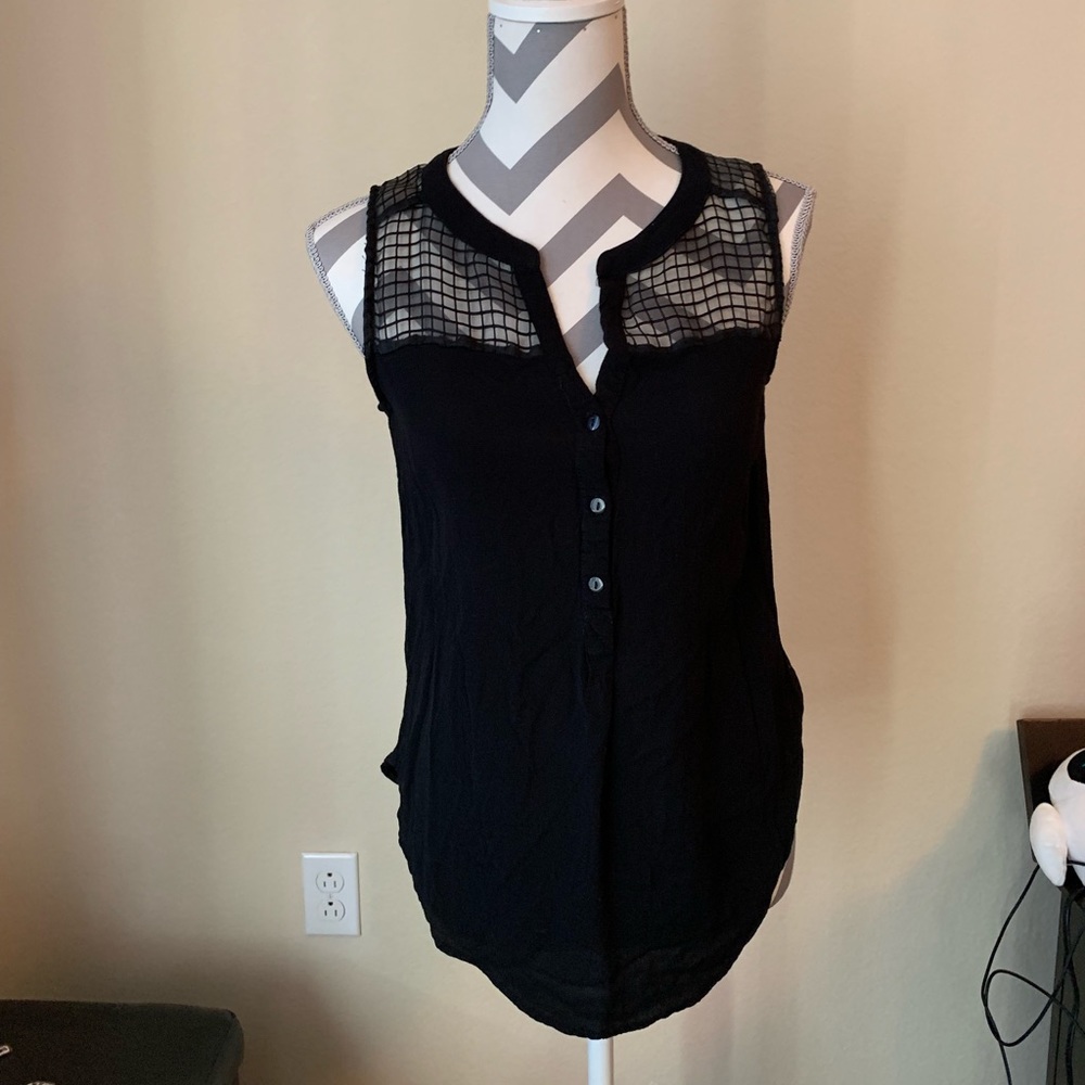 Black tank with decorative shoulders.